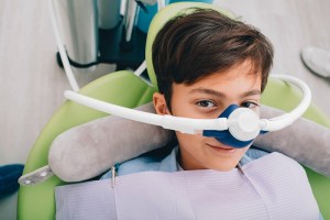 A kid having oral sedation